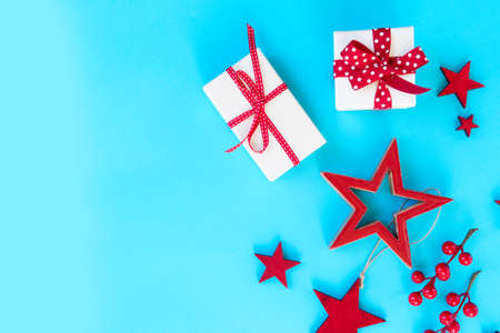 Christmas flat lay scene with stars and gift box on aqua blue background, copy spaceの写真素材