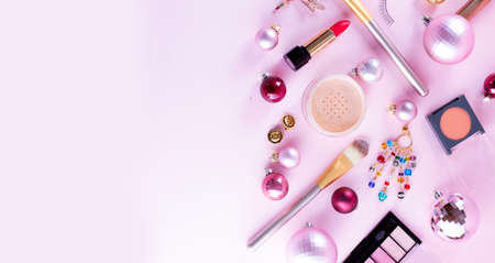 Festive make up products on pink background, web banner with copy spaceの写真素材