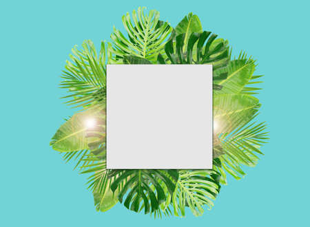 Tropical green fresh leaves frame layout with copy space over aqua blue background