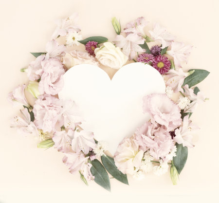 Flowers composition. Frame made of eustoma, lilly and daisy flowers on pink background. Flat lay, top view scene, tonedの写真素材