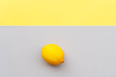 abstract modern handmade paper background with lemon in ultimate gray and illuminating yellow colorsの写真素材