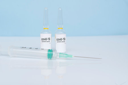 Vaccine and syringe, prevention,immunization and treatment from coronavirus covid 19 infectionの写真素材