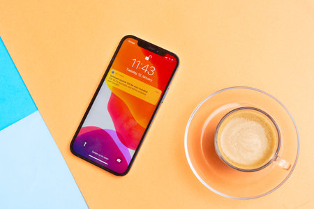 Puerto Cruz, Spain - january 12, 2020: new iPhone 12pro with coffee on bright background