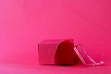 Minimal modern product display on red background with podium and heartの写真素材