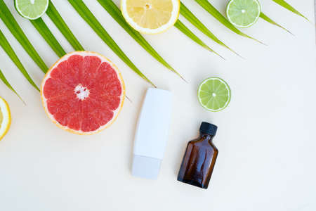 Citrus fruit vitamin c serum oil beauty bottles care, anti aging natural cosmetic with naturl friuts in gredientsの写真素材