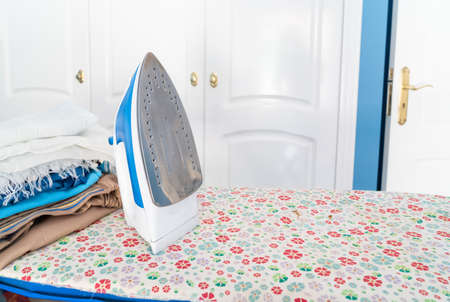 Ironing board with ironの写真素材