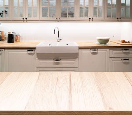 Wood table top on blur kitchen roomの写真素材