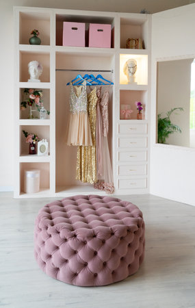 white modern wardrobe with stylish female clothesの写真素材