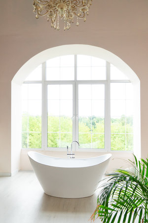 White bathroom with big window and bathtubeの写真素材