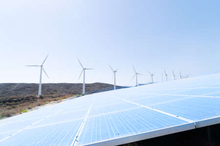 alternative energy concept - solar plant and wind mill farm,,tonedの写真素材