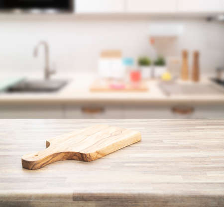 Wood counter top on blur kitchen room background. For montage product display or key visual layout.の写真素材