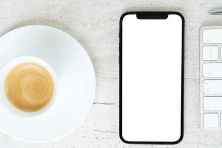 Desk mock up with modern phone, top viewの写真素材