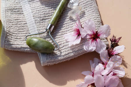 gua sha, face massage jade roller made of natural stone, close up view