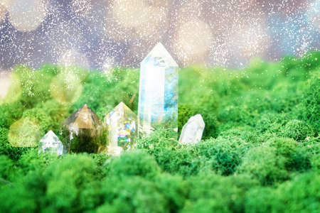gemstones minerals on mysterious natural forest moss background, quartz and calcite crystals close up. Magic healing Rock for Reiki Crystal Ritual, Witchcraft, spiritual esoteric practiceの写真素材
