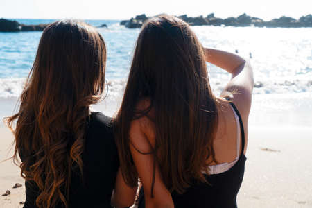 happy teenager girls having fun on the summer, rear view -  youth conceptの写真素材