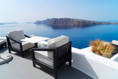 relaxing chairs with view of caldera, Santorini, Greece