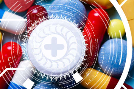 Modern medicine and cure engineering concept. Pile of colorful medical pills close up with abstract...