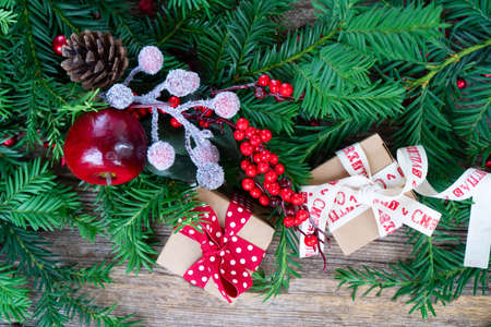 Christmas gift giving and zero waste concept - christmas gift box, border on wooden backgroundの写真素材