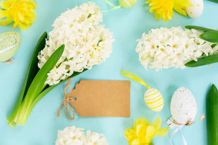 Easter scene with white eggs with rabbits ears over illuminating yellow background, palm shadows...