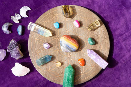 Gemstones minerals chakra stones over life flower chart. Magic healing Rock for Reiki Crystal...