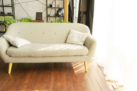 Stylish living room interior of classic apartment and trendy furniture, big window and elegant...