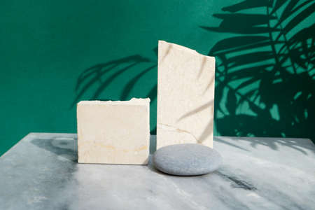 Minimal modern product display on reach green background with palm leaves and shadow overlay