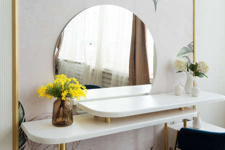 Dressing table with mirror close up in white roomの写真素材