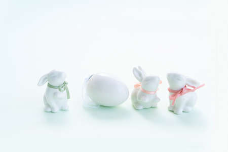 Easter Egg hunt with Easter white bunnies and egg