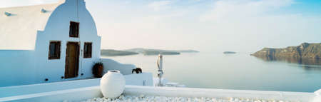 beautiful details of Santorini island - typical house with white walls and blue Aegan sea water, Greece, tonedの写真素材