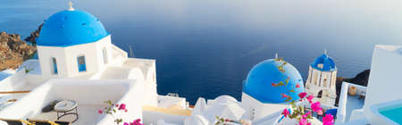 white church belfry, blue domes and volcano caldera with sea landscape, beautiful details of...