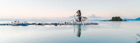 Vlacherna monastery and a boat at sunrise, Kanoni, Corfu island Greeceの写真素材