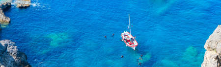 Paleokastritsa beach, small bay and Ionian sea clear water on Corfu, Greece, view from aboveの写真素材