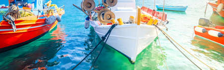 colorful fishing boats of Mykonos island, Greece with sunshineの写真素材