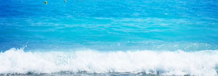 turquiose water of cote dAzur under summer sky with sunshine, France, retro tonedの写真素材