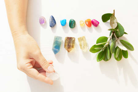 Gemstones minerals stones and obelisks with herbs. Hands holding moon. Witchcraft, herbal medicine and healing, Magic healing Rock for Reiki Crystal Ritual, Witchcraft, spiritual esoteric practiceの写真素材