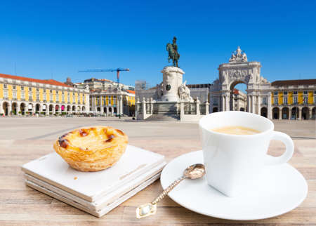 cafe with pasteles de nata and view of famous Lisbon Commerce Square, Portugalの写真素材