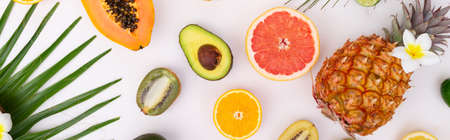 fresh fruits with green leaves food pattern flat lay scene, summer diet backgroundの写真素材