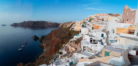 traditional greek village Oia of Santorini, street against deep Aegan sea and caldera, Greece, web banner formatの写真素材
