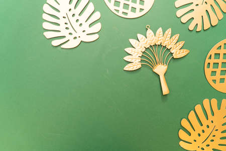 Summer background with golden leaves over deep green backgroundの写真素材