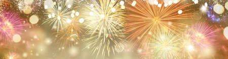 Abstract festive winter bokeh background with fireworks and bokeh lights, web banner format