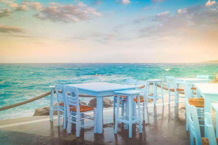 seaside cafe at Mykonos island, Greece at summer sunsetの写真素材