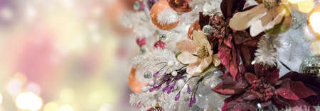 christmas evergreen fresh tree with holiday decorations and lights with copy space on magic...