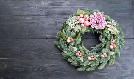 Cristmas wreath garland decorations over dark backgroundの写真素材