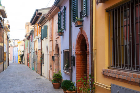 romantic street with colorful houses in old town of Rimini, Italy