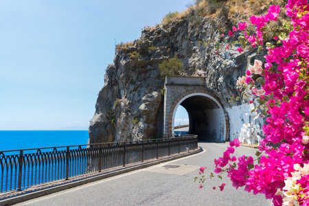 famous picturesque winding road of Amalfi coast, summer with flowers, Italyの写真素材
