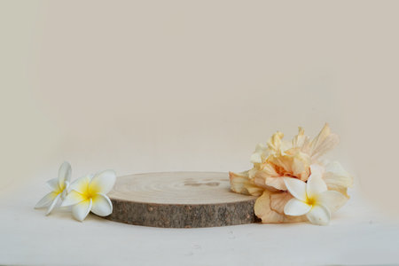 Minimal modern product display podium on neutral background with natural podium, tropical summer flowersの写真素材
