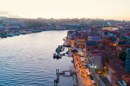 Picturesque, colorful view at old town Porto at sunset, Portugal with bridge Ponte Dom Luis over...