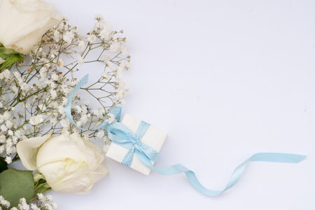 wedding or mothers day background, bouquet with gift box over white backgroundの写真素材
