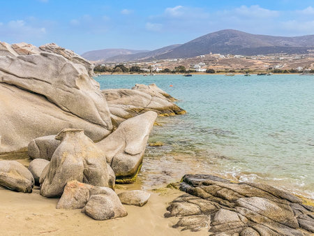 Romantic beach with rocks at greek island, Paros Greece with sunshine, panorama web formatの写真素材