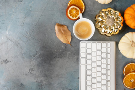 thnksfiving day harvest of pumkins with pc keyboard, top view, working desk, mock up with copy spaceの写真素材